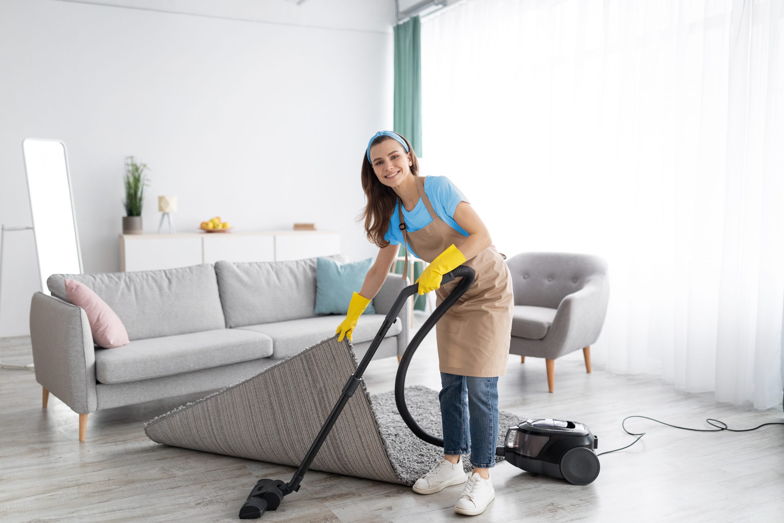 Same day cleaners female-housekeeper-using-vacuum-cleaner